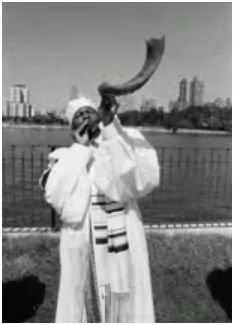 a member of the Commandments Keepers, from NYC, blowing the Shofar.